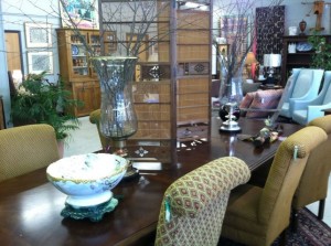 This dining room table has 2 leaves and a great price of 395.00. The chairs are priced at 119.00 a piece .